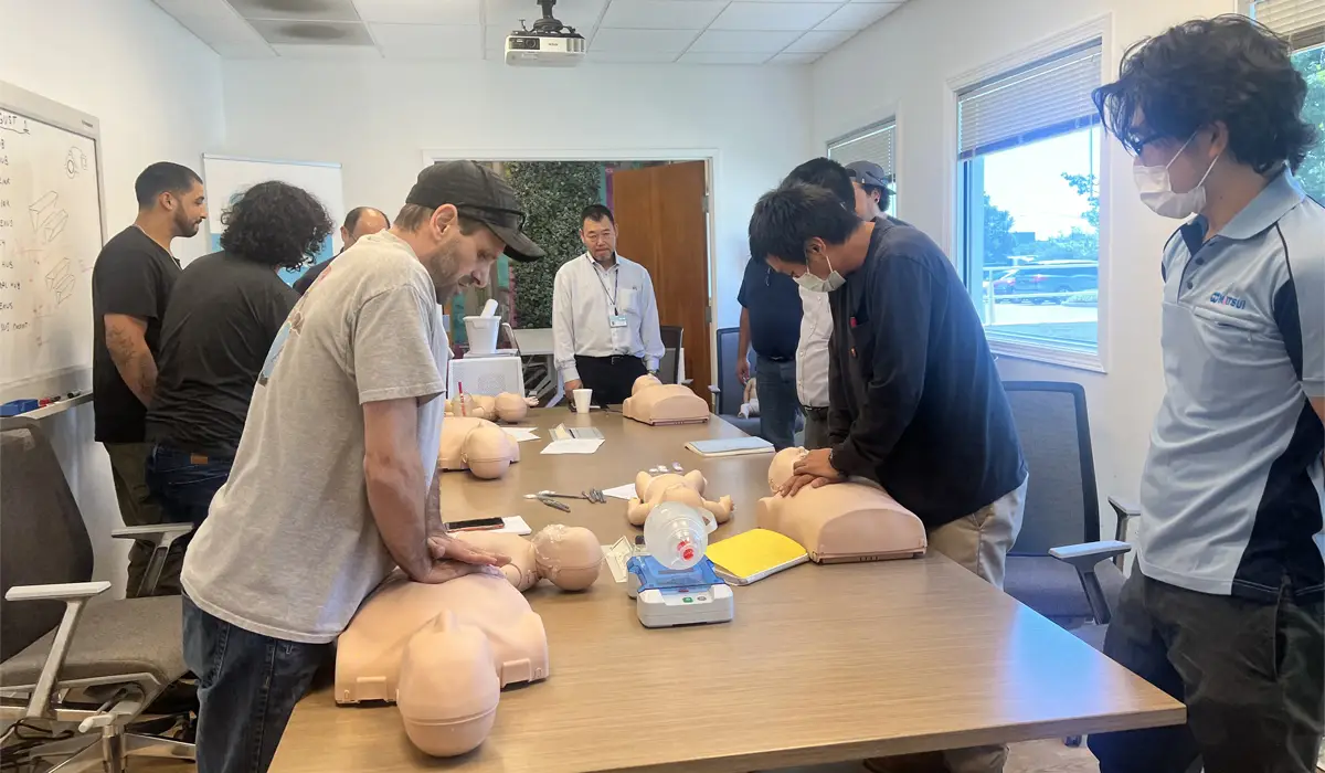 A group of people in a CPR training