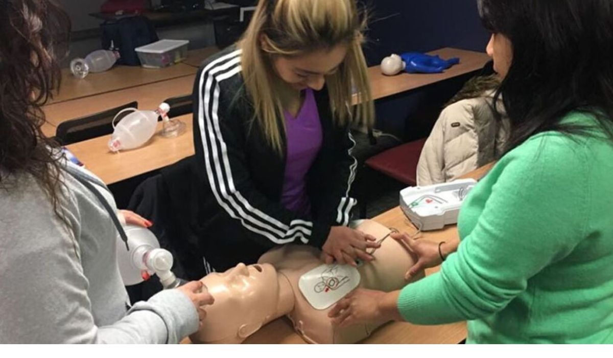 three women learning CPR