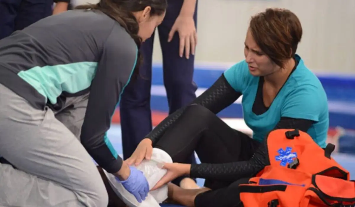 A Woman Applying A Plaster Cast To The Foot Of Another Woman