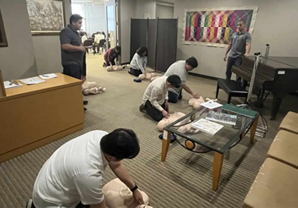 PCG personnel perform CPR and proper AED operation on Brayden CPR Manikins