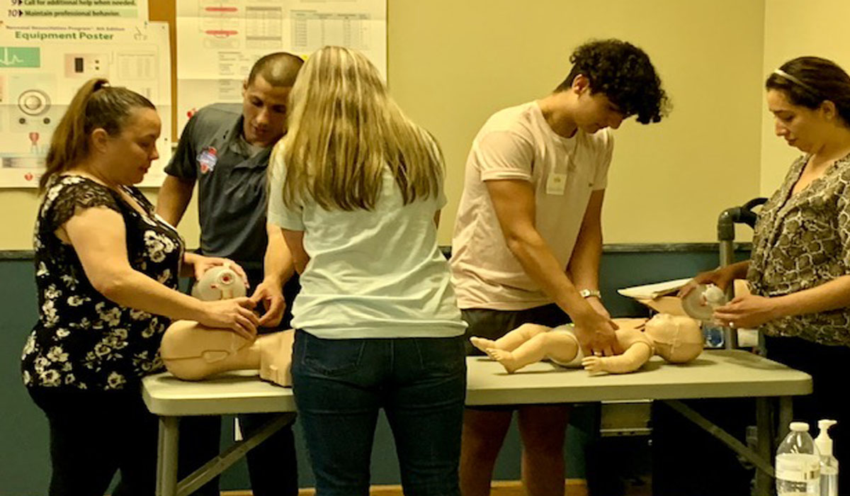 a group of people attending a CPR training class