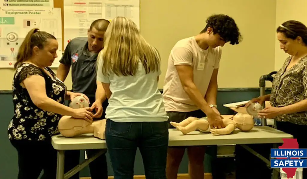 A bunch of people attending basic CPR training,