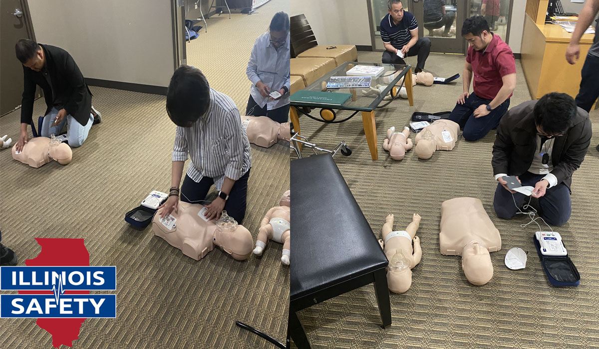 Participants demonstrating an emergency lifesaving procedure performed when the heart stops beating.