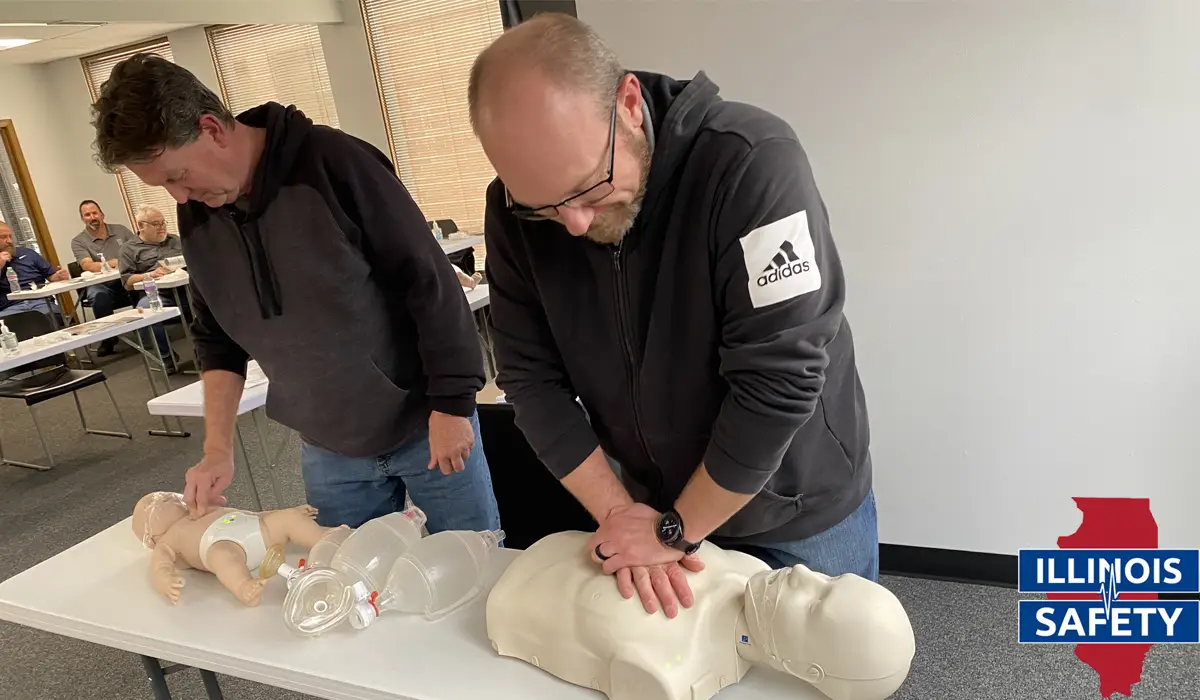 Two men learning the basic way in conducting CPR.