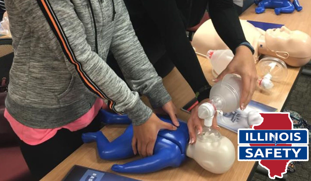 a woman practicing CPR on an infant CPR manikin