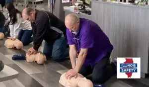 Participants engaging in life support courses at Illinois Safety, focusing on corporate CPR training and first aid training for employees, to enhance workplace safety