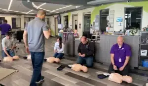 Healthcare professionals practicing CPR techniques during an ACLS Certification class in Chicago