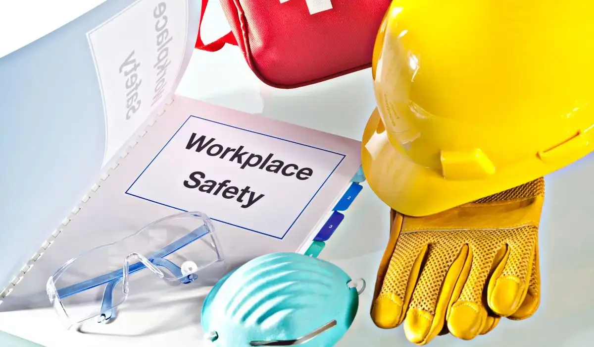 Workplace safety records, protective gloves, hard hat, and PPE gear for maintaining OSHA-compliant documentation in 2025.