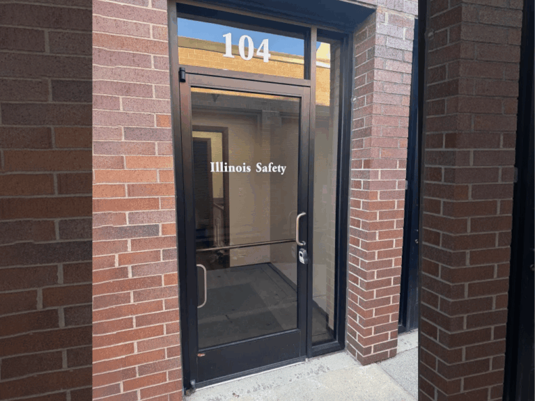 Storefront signs for Skip Saviano's Elmwood Park Village President office and Illinois Safety CPR-AED-First Aid Training, address 17.