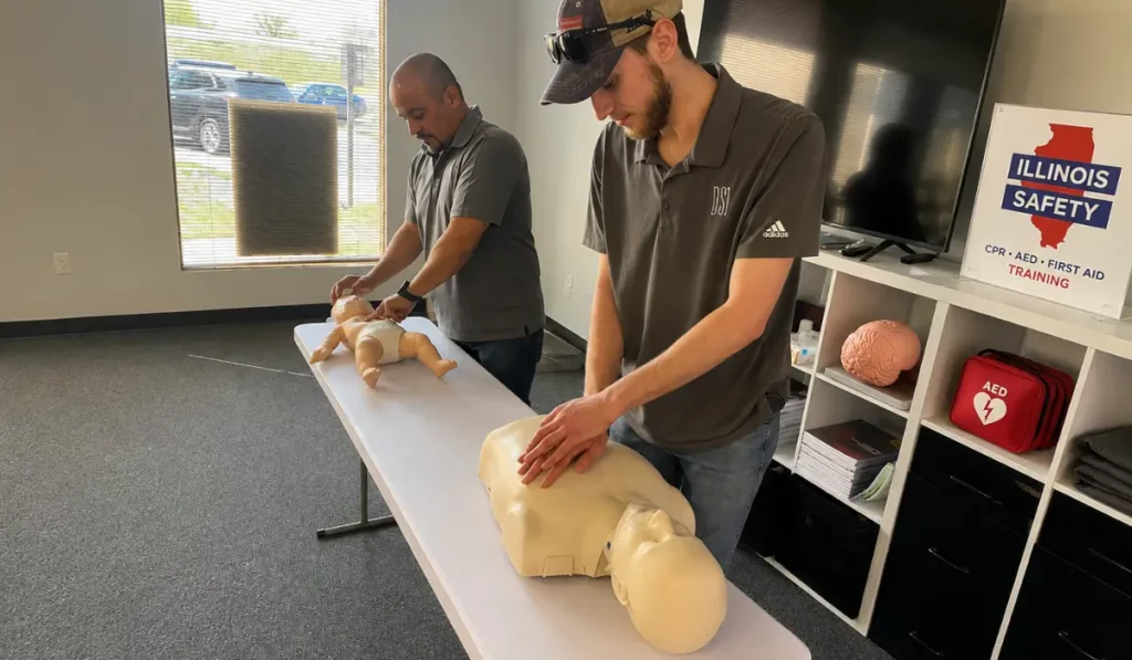 Mental health crisis preparedness includes trainees practicing CPR on manikins during hands-on physical emergency training.